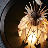 Domita M/36 wood bell table lamp with interlocking pale beech slats forming a bell-shaped shade, brown central stem and round flat knob, illuminated from within.
