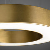 Close-up of the Silver Ring LED pendant light, a slim 123cm circular ring in a brushed gold finish with integrated warm white LED lighting the underside.
