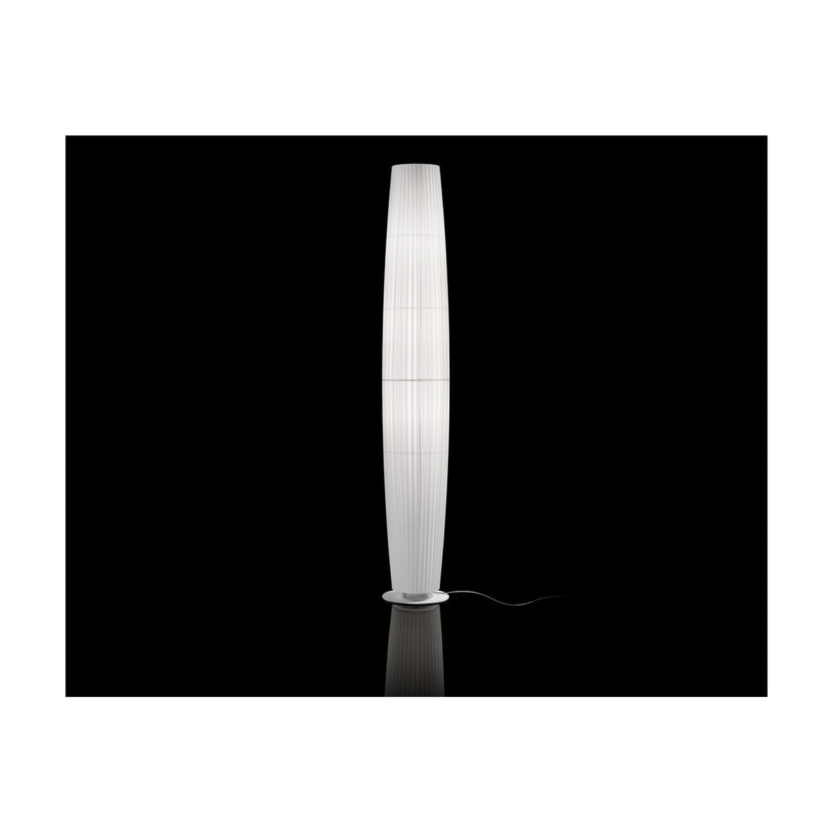 Maxi P/03 Ribbon Cylinder Floor Lamp with a tall, tapered pleated white shade on a round base, shown illuminated against a black background.