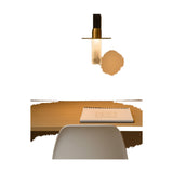 Beira W Glass LED wall light with black fitting, brass disc and frosted glass diffuser tube, shown lit on a plain background above a lifestyle desk scene with notebook and chair.