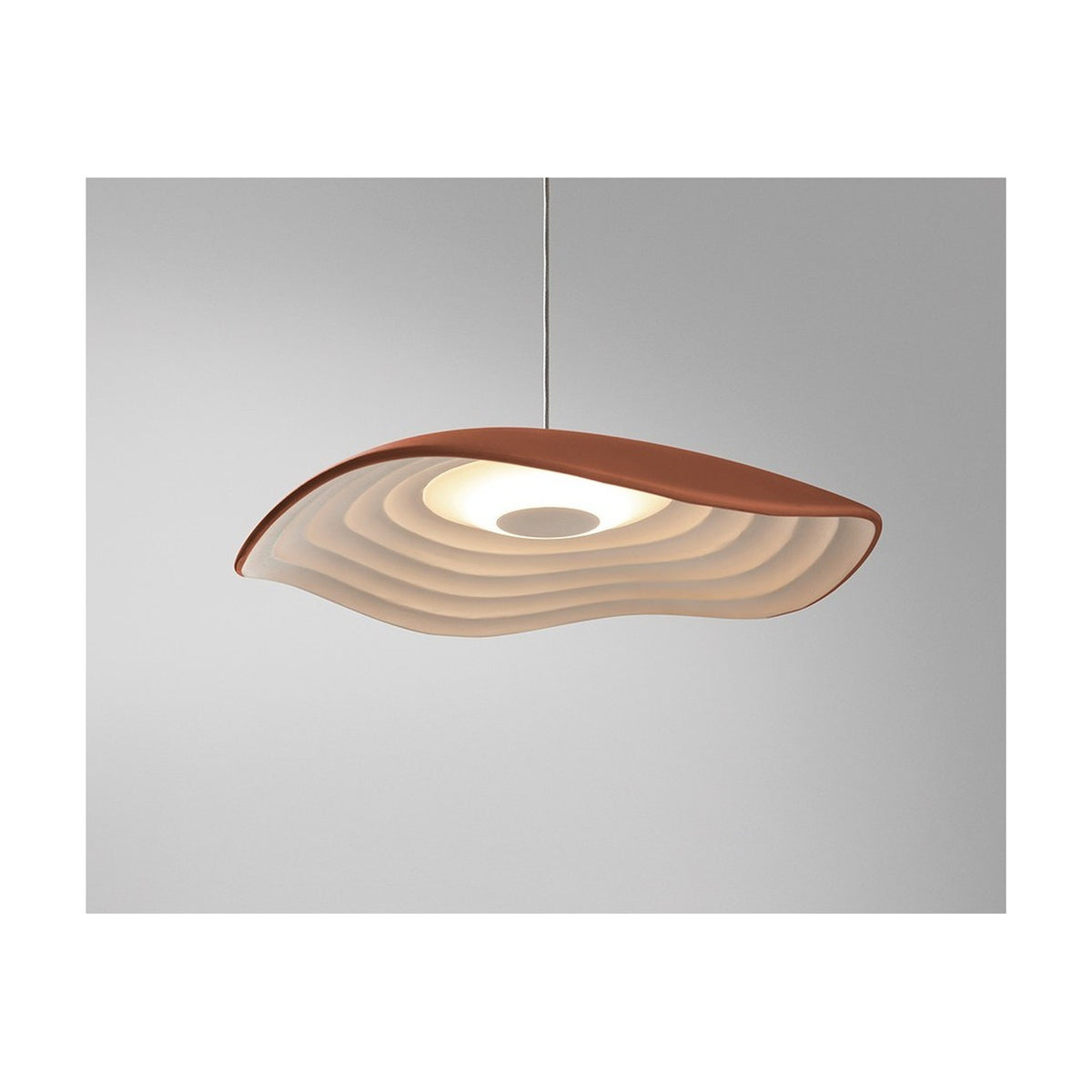 Valentina S/24 aluminium LED pendant light with a wavy organic shade, terracotta finish on top and white tiered interior, shown against a plain grey background.