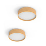 Two Bloom LED drum flush ceiling lights in ash wood with round white diffusers, shown from above on a plain white background.