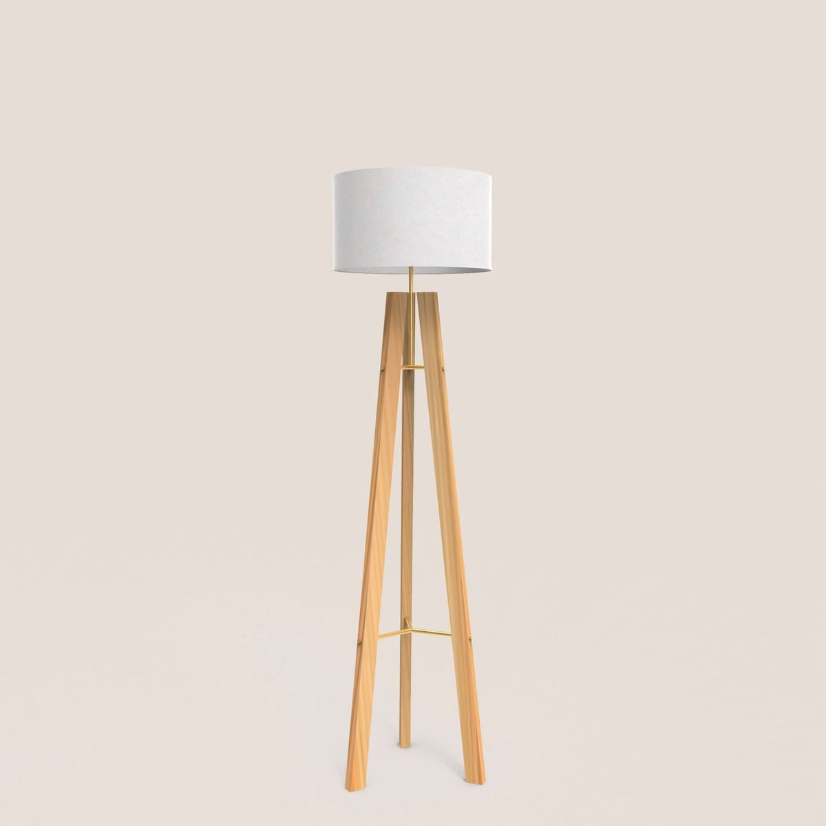 Breeze Fabric Drum Tripod Floor Lamp with light wood tripod legs, slim gold stem and braces, and a white cotton drum shade, shown on a plain background.