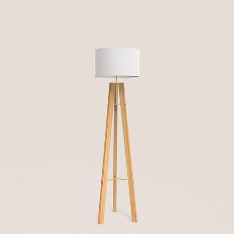 Breeze Fabric Drum Tripod Floor Lamp with light wood tripod legs, slim gold stem and braces, and a white cotton drum shade, shown on a plain background.