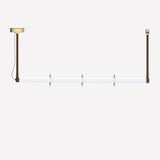 Roseline LED Ribbed Glass Linear Pendant Light in gold and brown, a long fluted glass bar with three gold discs, hung level on two brown straps against a plain white background.