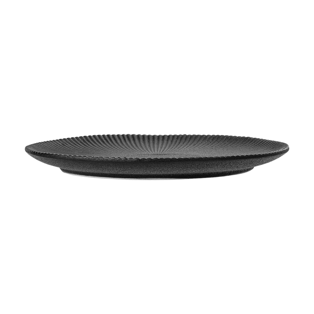 Neri Stoneware Side Plate in black, shown side-on with ribbed sunburst texture radiating from the centre to the rim, on a plain white background.