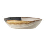 Jules Stoneware Deep Plate in Multi, oval ceramic dish with reactive glaze in black, ochre, and cream tones, shown against a plain white background.
