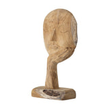 Cacia Wooden Ornament in natural reclaimed wood, a carved face with closed eyes resting on an open hand atop a slender stem and block base, shown on a plain white background.
