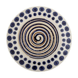 Shama Dotted Stoneware Side Plate in multi colourway, hand-decorated with a brown and navy spiral centre and a navy dotted border, shown on a plain white background.