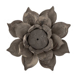 Eira Flower Stoneware Tealight Holder in brown, shaped like a layered open flower with pointed petals curling around a central tealight well, shown on a plain white background.