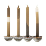 Kalia Stoneware Advent Candle Holder in brown, a four-cup stoneware tray with reactive glaze holding four tall taper candles in brown and cream tones, shown on a plain white background.