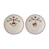 Yule Stoneware Christmas Plates Set of 2 in cream with red rim, each featuring a pine sprig, heart, and either a horn or drum design, shown on a white background.