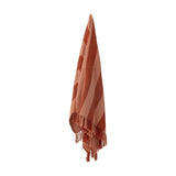 Frello Striped Cotton Throw in Orange, woven with broad two-tone stripes and knotted fringe ends, shown hanging against a plain white background.