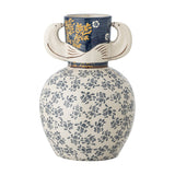 Hezha Floral Stoneware Vase in blue with a cream floral body, deep blue banded neck featuring yellow foliage, and bird-head shaped side handles, on a white background.