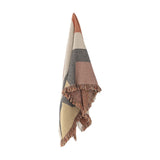 Arni Throw in Multi hanging against a white background, showing a woven fabric with curved colour-block panels in rust, grey, beige and cream, finished with a thick mixed-yarn fringe.