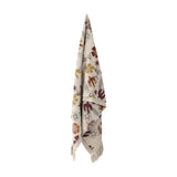 Vivielle Floral Throw in multicoloured cotton-blend fabric, printed with flowers, leaves and birds, shown hanging with fringed edges against a plain white background.