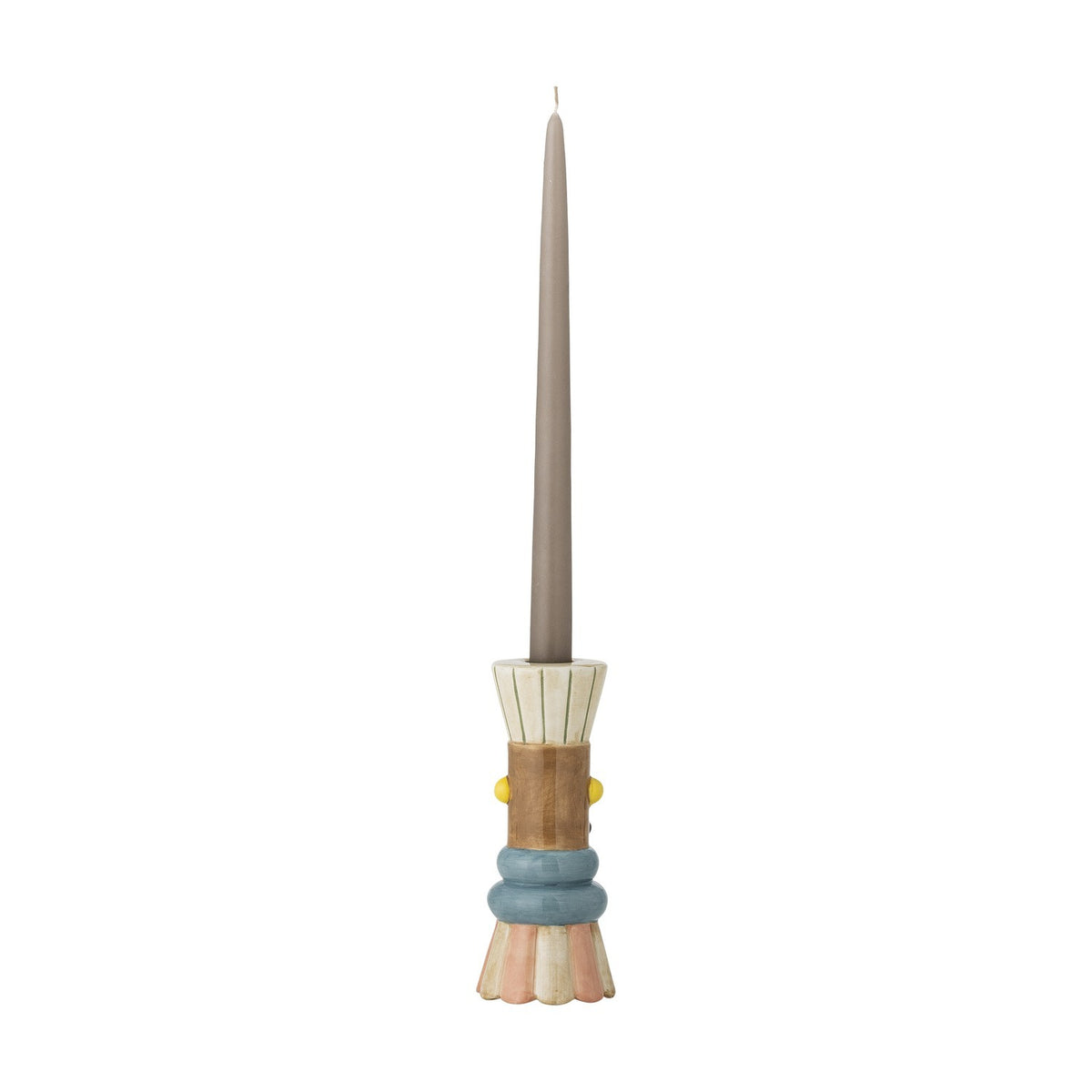 Minio Ceramic Vase styled as a candle holder base, shaped like a tiered figure in cream, tan, blue, and pink tones, holding a tall grey taper candle on a plain white background.