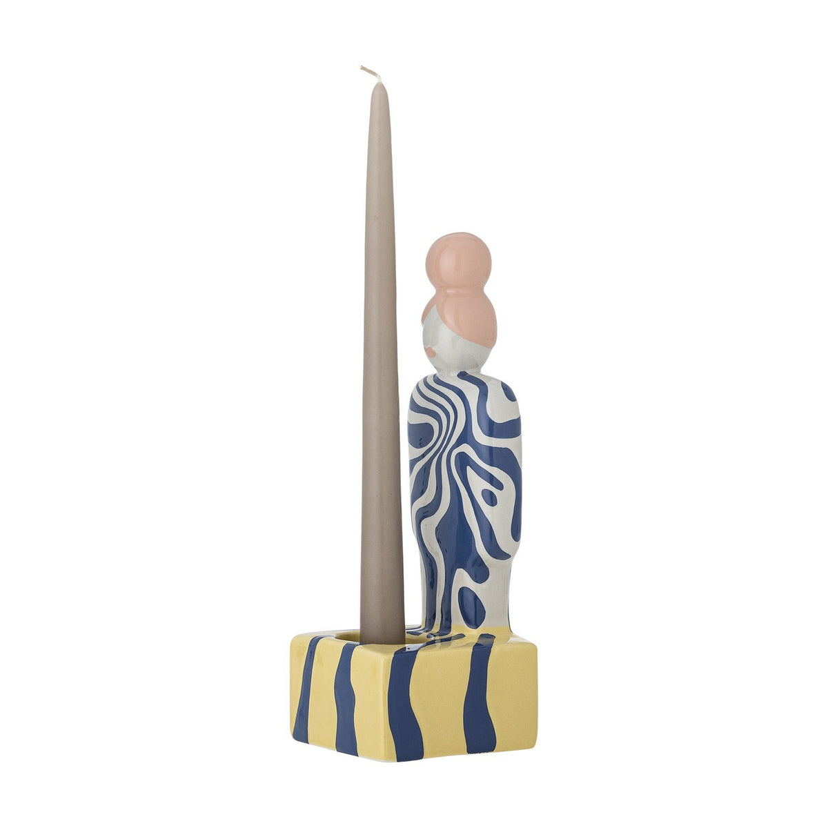 Priya Stoneware Tealight Holder in Multi, a ceramic figure with a blue swirl-patterned body and pink bun, holding a tall taper candle on a yellow striped base, shown on a white background.