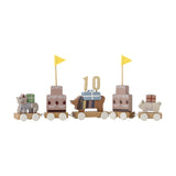 Wooden birthday train with five linked wagons featuring a cat, two tiered cakes with yellow pennant flags, a dachshund holding a "10" topper, and a small animal, on a white background.