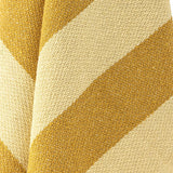 Close-up of the Frello Striped Cotton Throw in yellow, showing woven diagonal stripes in deep and pale yellow tones with a textured knit finish.