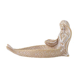 Abitha Shell Stoneware Bowl in beige, shaped as a reclining mermaid with a scaled tail forming the dish and hands cupping a small shell hollow, on a plain white background.