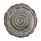 Marjorie Round Stoneware Tray in brown, a shallow serving dish with a scalloped wavy rim and spiral glaze pattern winding from the centre, shown on a plain white background.