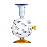 Phila Glass Candle Holder in Blue, a clear glass puffer fish-shaped holder with raised blue spines, an amber fin and base, and a flared blue cup top, on a white background.