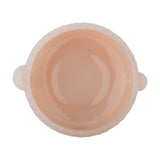 Top view of the Lalie Ribbed Glass Bowl in pink, showing its round shape, ribbed outer wall, smooth glossy interior, and two rounded side lugs, set against a white background.