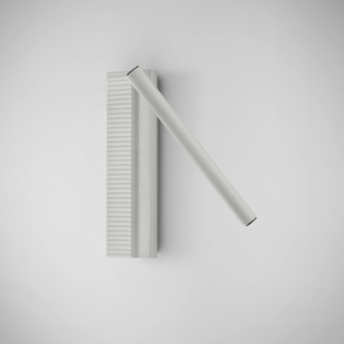 Arid A/03 Aluminium LED Wall Light in Textured White, with a ribbed vertical back plate and a single angled tube, shown on a plain light background.