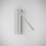 Arid A/03 Aluminium LED Wall Light in Textured White, with a ribbed vertical back plate and a single angled tube, shown on a plain light background.