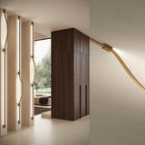 Bow LED Module Kit 50cm wall-mounted light fitting in warm wood tone, shown curving from a straight recessed track into a wavy profile with visible fixing springs.