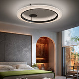 Roda PF/150 Ribbon LED ceiling light with cream pleated ring, black inner trim and centre plate, shown glowing above a modern bedroom.