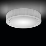 Urban PF/120 Ribbon LED ceiling light, a large round fixture with a white ribbed drum shade and glowing white diffuser, shown against a dark background.