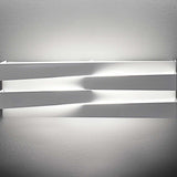 Cross Glass LED Wall Light 30cm in white finish, two crossing bars mounted on a wall, glowing warm light along the gap above and below, shown against a plain light grey background.