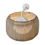 Fora A Drum LED outdoor wall light with a round, light beige woven shade on a slim white wall-mounted arm, glowing warmly against a plain white background.