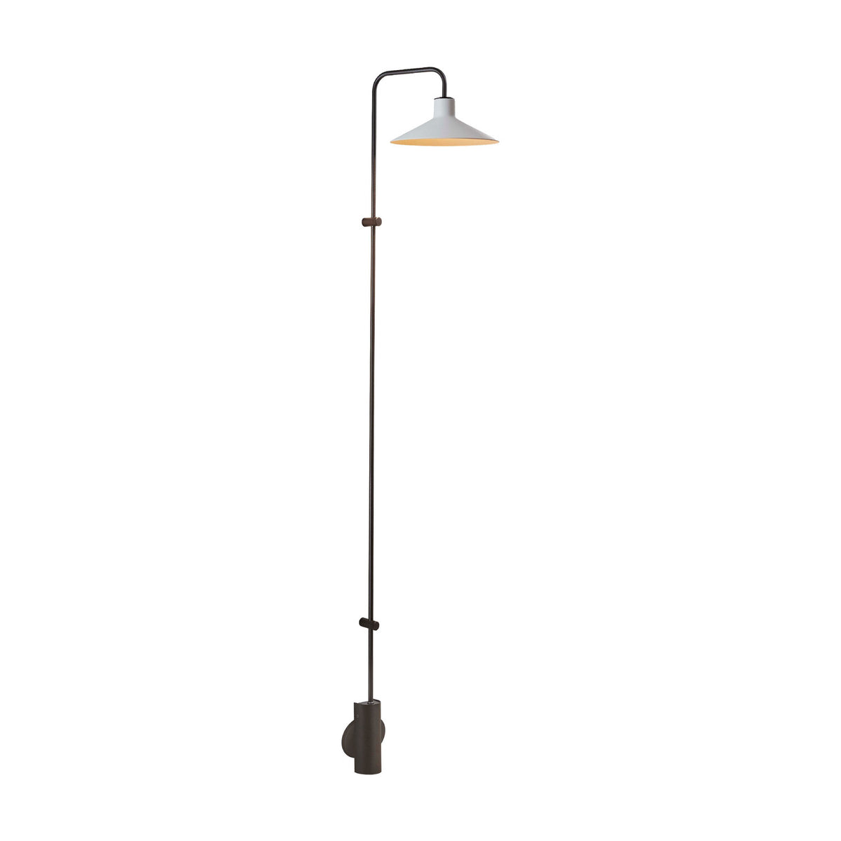 Platet A/06 aluminium LED wall light in dark brown finish, with a tall slim rod rising from a cylindrical wall base to a curved arm holding a single conical shade, shown on a plain white background.