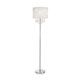 The Brillis Crystal Floor Lamp - Chrome is a luxurious lighting piece, showcasing a sleek chrome finish with a slim silver stand and a round white lampshade. Elegantly hanging crystal-like beads adorn the area beneath the shade, while the lamp stands gracefully on a flat circular base.