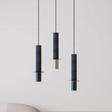 Rita Concrete Pendant lights in matt black with a disc detail and brass and black iron heads, shown in three lengths against a plain light background.