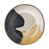 Jules Stoneware Deep Plate in Multi, round ceramic design with a reactive glaze in black, cream, and amber tones, shown on a plain white background.