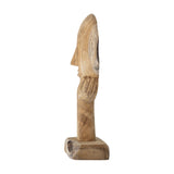 Cacia Wooden Ornament in Natural – carved reclaimed wood sculpture of a calm face resting on an open hand, tapering stem on a block base, shown against a white background.