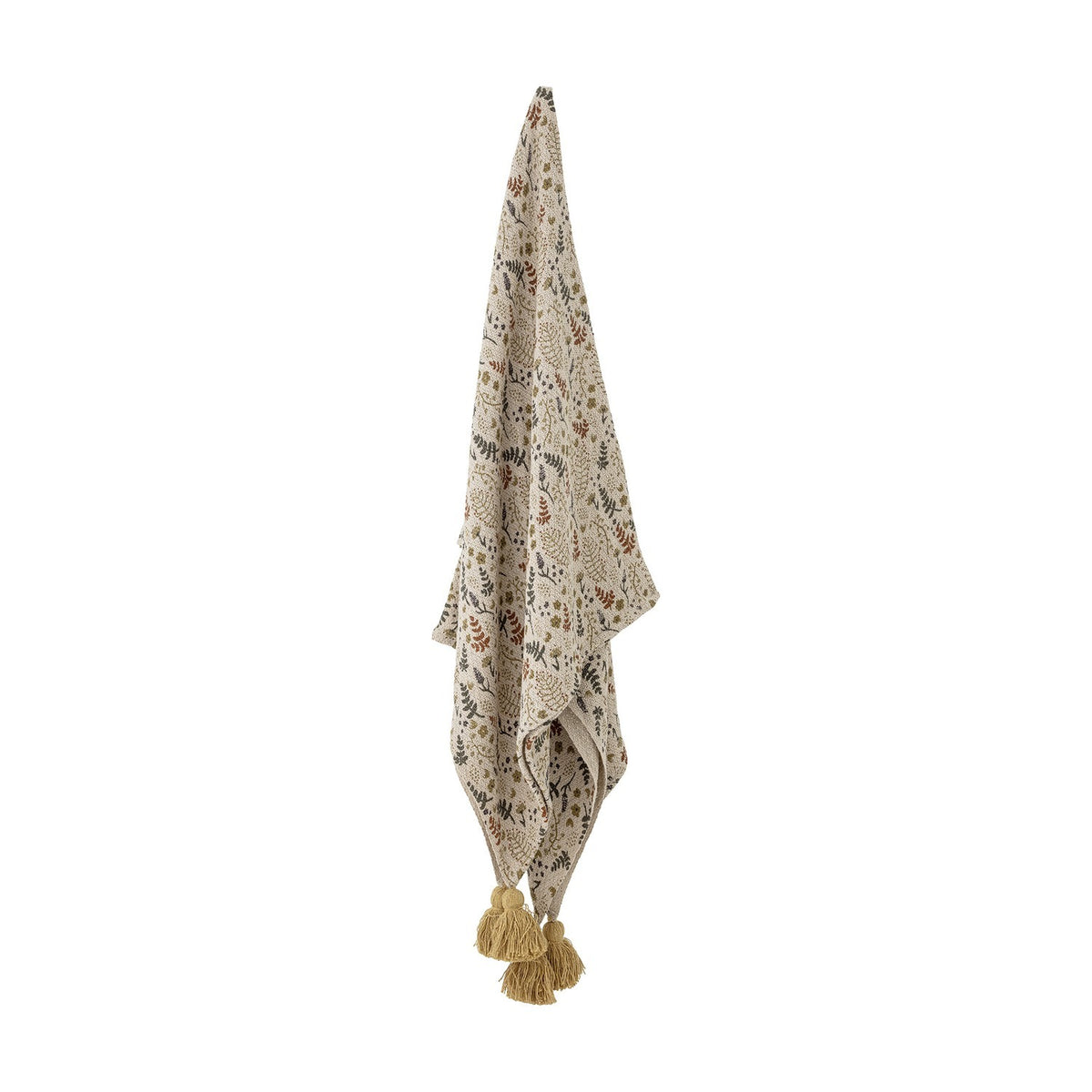Filipa Floral Cotton Throw in multicoloured fern and floral print, shown hanging with corner tassels against a plain white background.