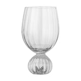 Taurin Round Wine Glass in clear ribbed glass with a rounded footed base instead of a stem, shown on a plain white background.