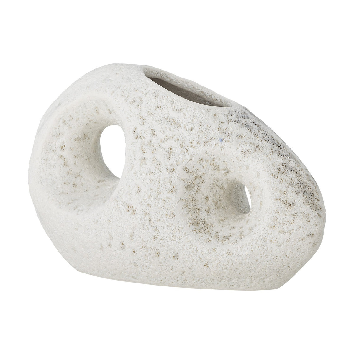 Caia Pebble Stoneware Vase 9.5cm in White, a small pebble-shaped ceramic vase with two round through-holes and a matt, finely pitted textured surface, shown on a plain white background.