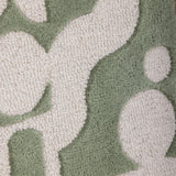 Close-up of the Longton Wool Wall Decor in green, showing tufted abstract shapes in cream against a denser green ground with a looped textile texture.