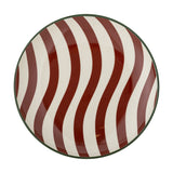 Jolly Striped Stoneware Christmas Plate in multi, a round 16cm stoneware side plate with wavy red and cream stripes and a thin green rim line, shown on a plain white background.