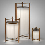 Kando P/111/R rechargeable floor lamps in three heights, each with a pleated cream ribbon shade in an open wood frame with dark brown top disc and tripod legs, on a plain light grey background.