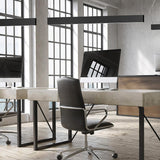 Giano Aluminium Linear LED Pendant Light 151.8cm in black, slim squared bar suspended above an office desk with computer monitors and a grey chair.