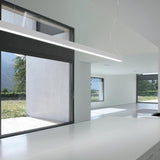 Brooklyn Line Aluminium Linear LED Pendant Light 152cm in white, shown suspended from a ceiling near a glazed sliding door in a modern white-toned open-plan living space.