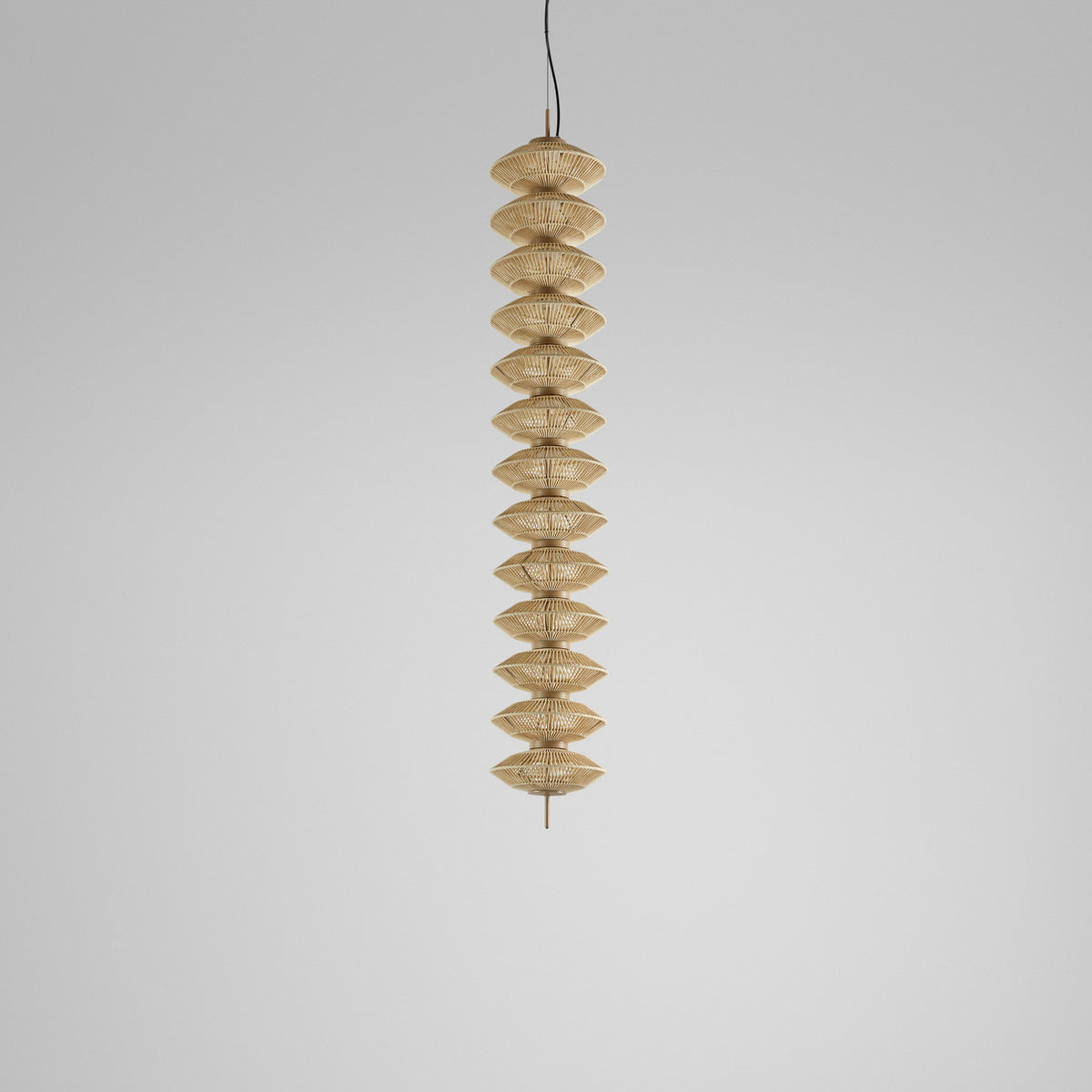 Yuyun S/11L/I pendant light with eleven stacked double-cone shades of satin beige fabric on a slim central stem, shown against a plain light grey background.