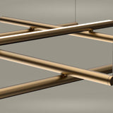 Hilow Black Diffuser Frame LED Pendant Light, close-up of crossing brushed bronze bars forming an open grid with integrated warm-white LED strips, shown against a plain grey background.